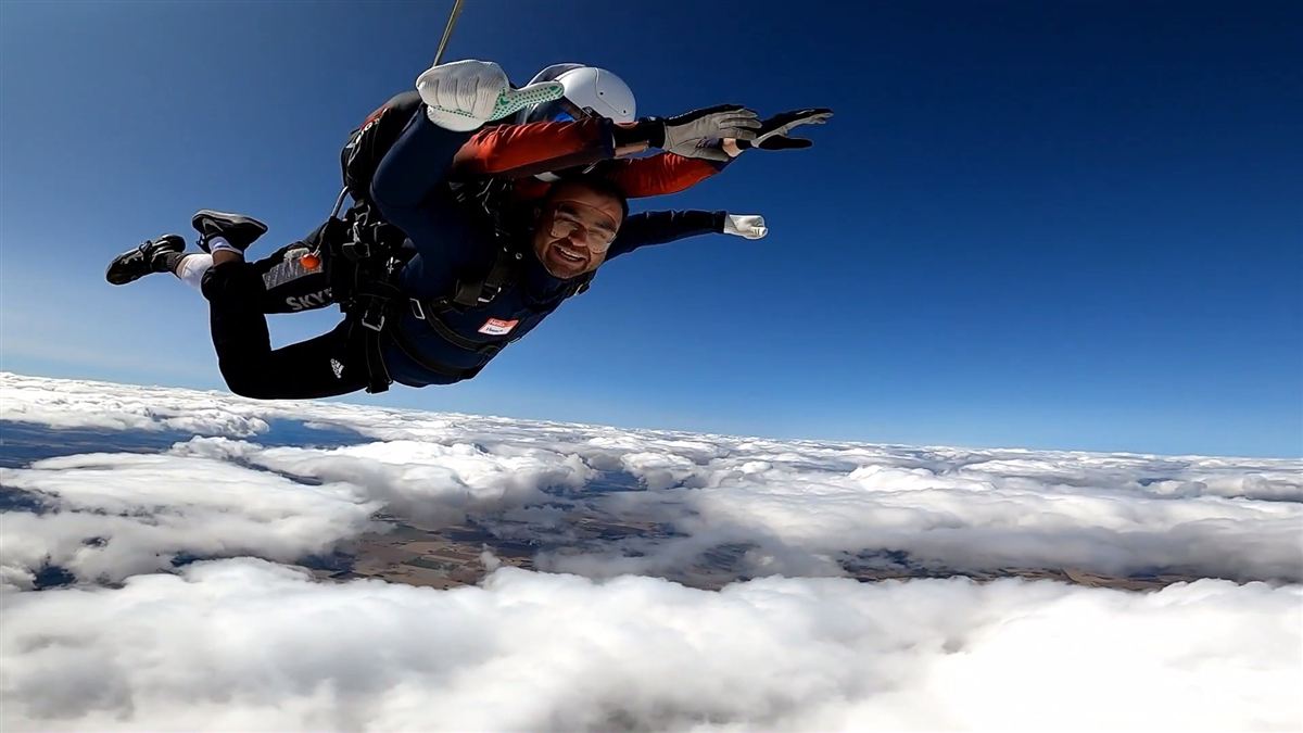 Huseyin Ergin skydiving above the clouds.
